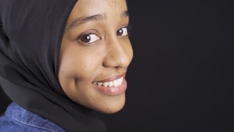 Muslim-African-young-woman-in-hijab-with-white-shiny-teeth.